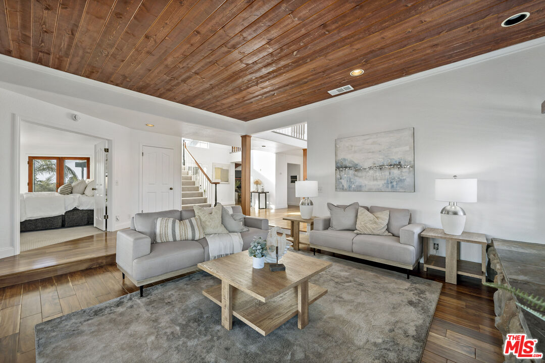 38675 Green Meadow Road Temecula, CA 92592 - Photo 57 of 74 a living room with furniture and a rug