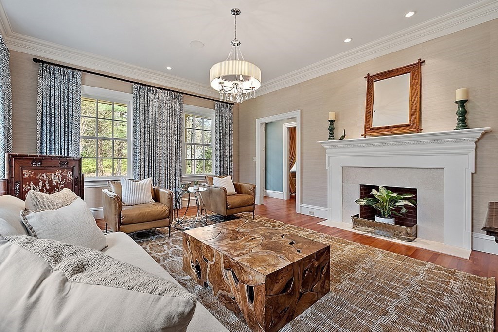 75 Oxbow Road Concord, MA 01742 - Photo 13 of 41 a living room with furniture and a fireplace