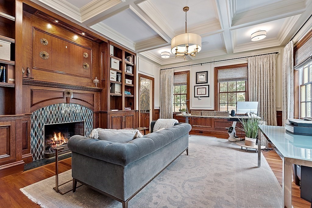75 Oxbow Road Concord, MA 01742 - Photo 16 of 41 a living room with furniture a chandelier and a fireplace