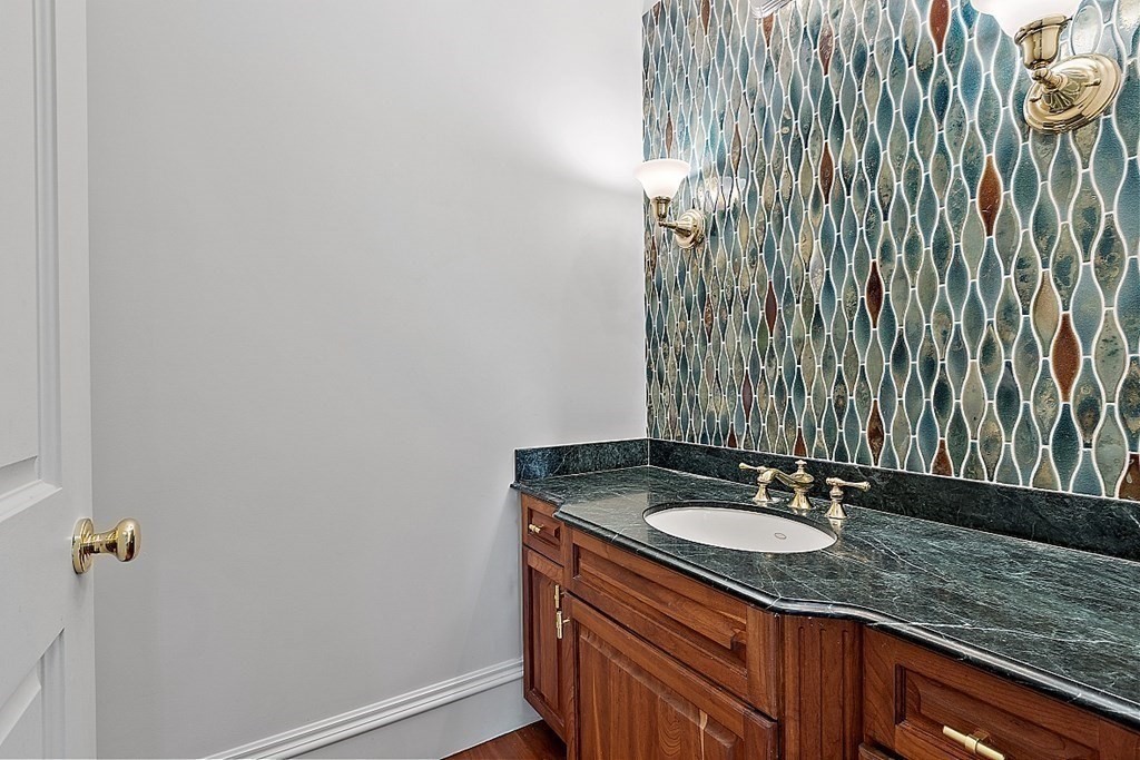 75 Oxbow Road Concord, MA 01742 - Photo 17 of 41 a bathroom with a granite countertop sink and a mirror