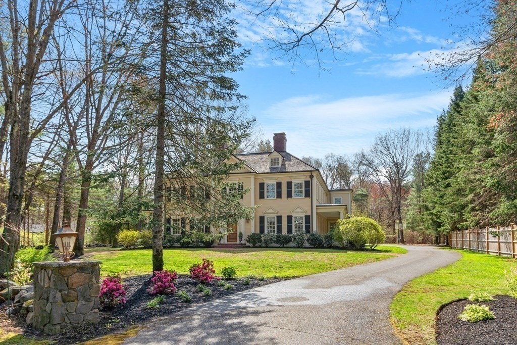 75 Oxbow Road Concord, MA 01742 - Photo 2 of 41 a view of a house with a big yard and large trees