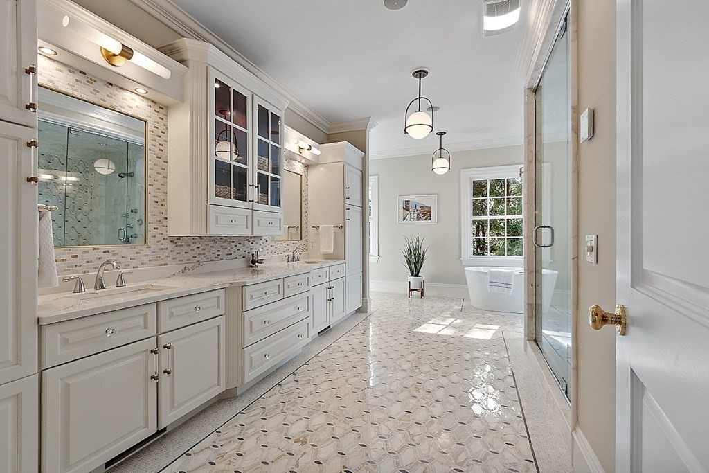 75 Oxbow Road Concord, MA 01742 - Photo 23 of 41 a bathroom with a granite countertop sink a mirror and a shower