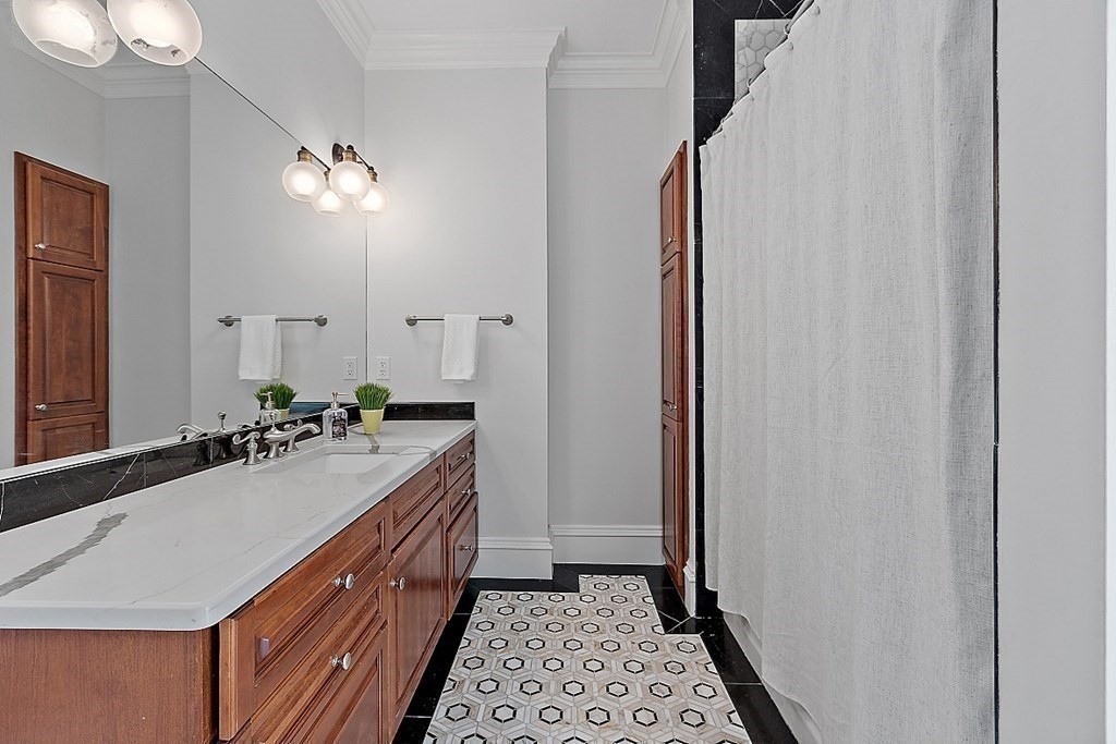 75 Oxbow Road Concord, MA 01742 - Photo 29 of 41 a bathroom with a sink and a mirror