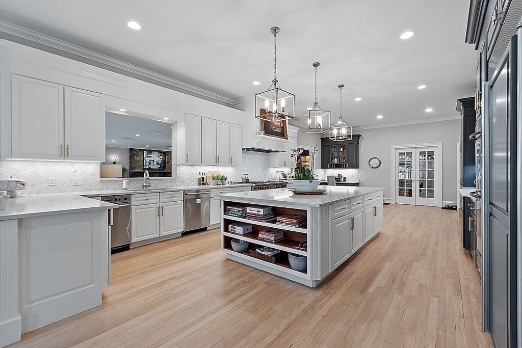 75 Oxbow Road Concord, MA 01742 - Photo 7 of 41 a kitchen with stainless steel appliances a stove top oven and cabinets