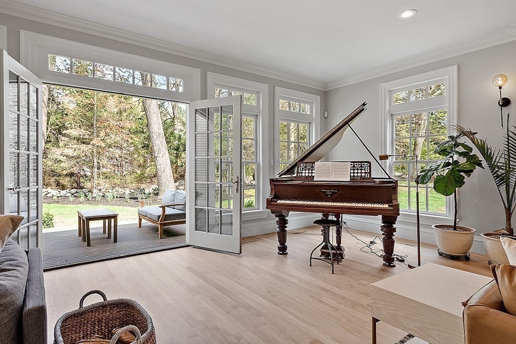 75 Oxbow Road Concord, MA 01742 - Photo 9 of 41 a living room with furniture a table and a potted plant