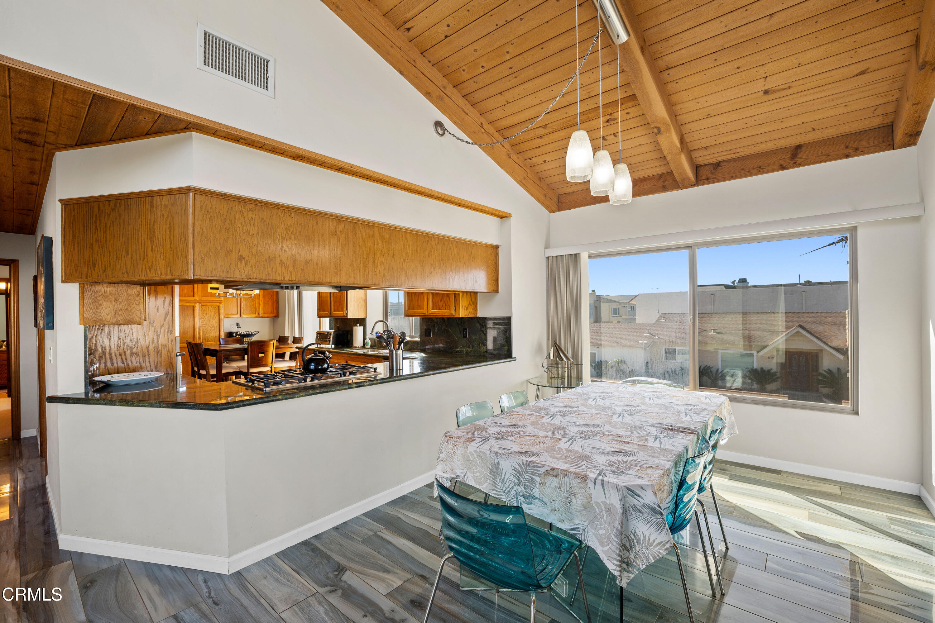 1150 Mandalay Beach Road Oxnard, CA 93035 - Photo 12 of 48 a view of a dining room with a table and chairs