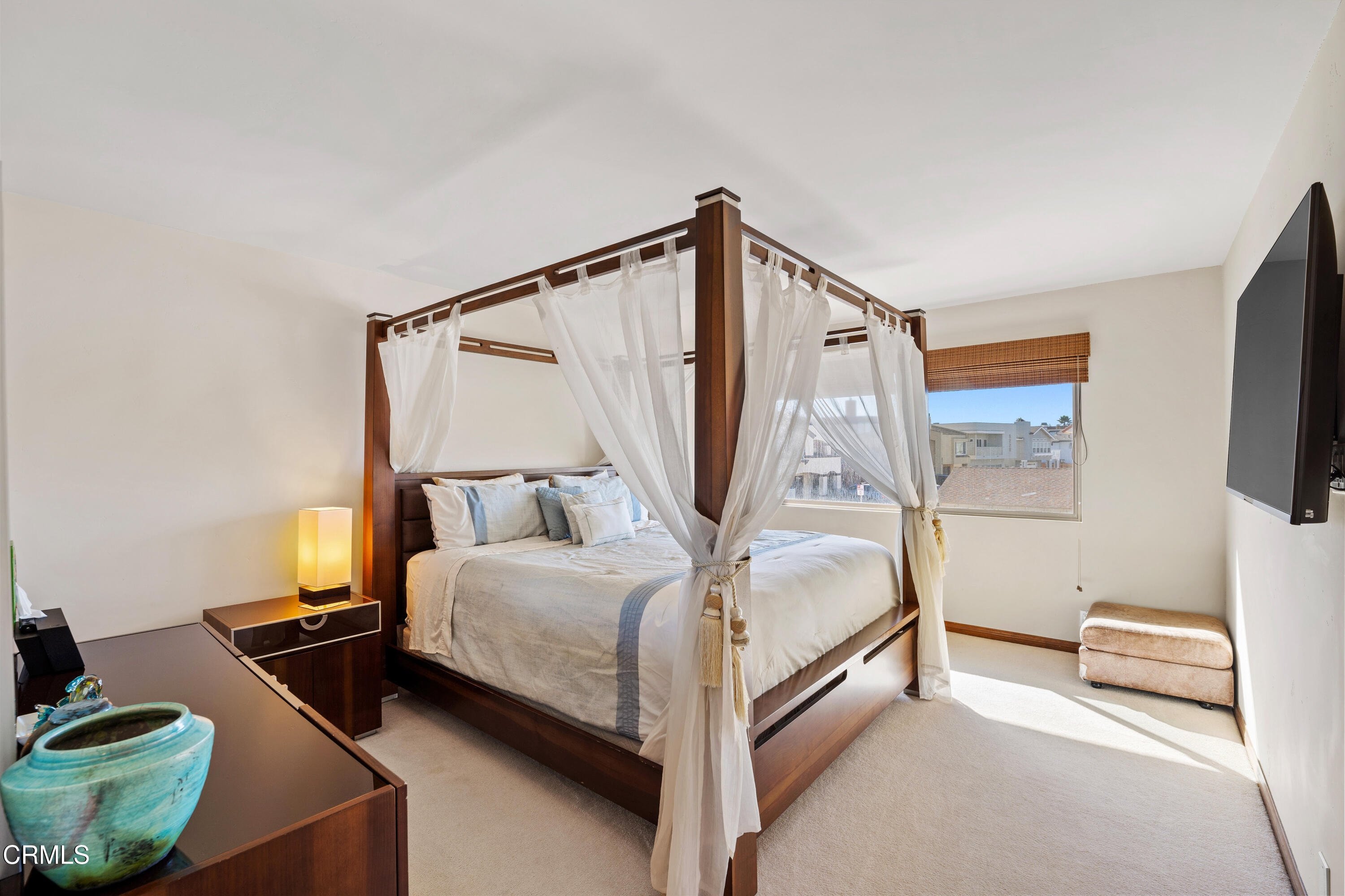 1150 Mandalay Beach Road Oxnard, CA 93035 - Photo 18 of 48 a bedroom with a bed and a flat screen tv