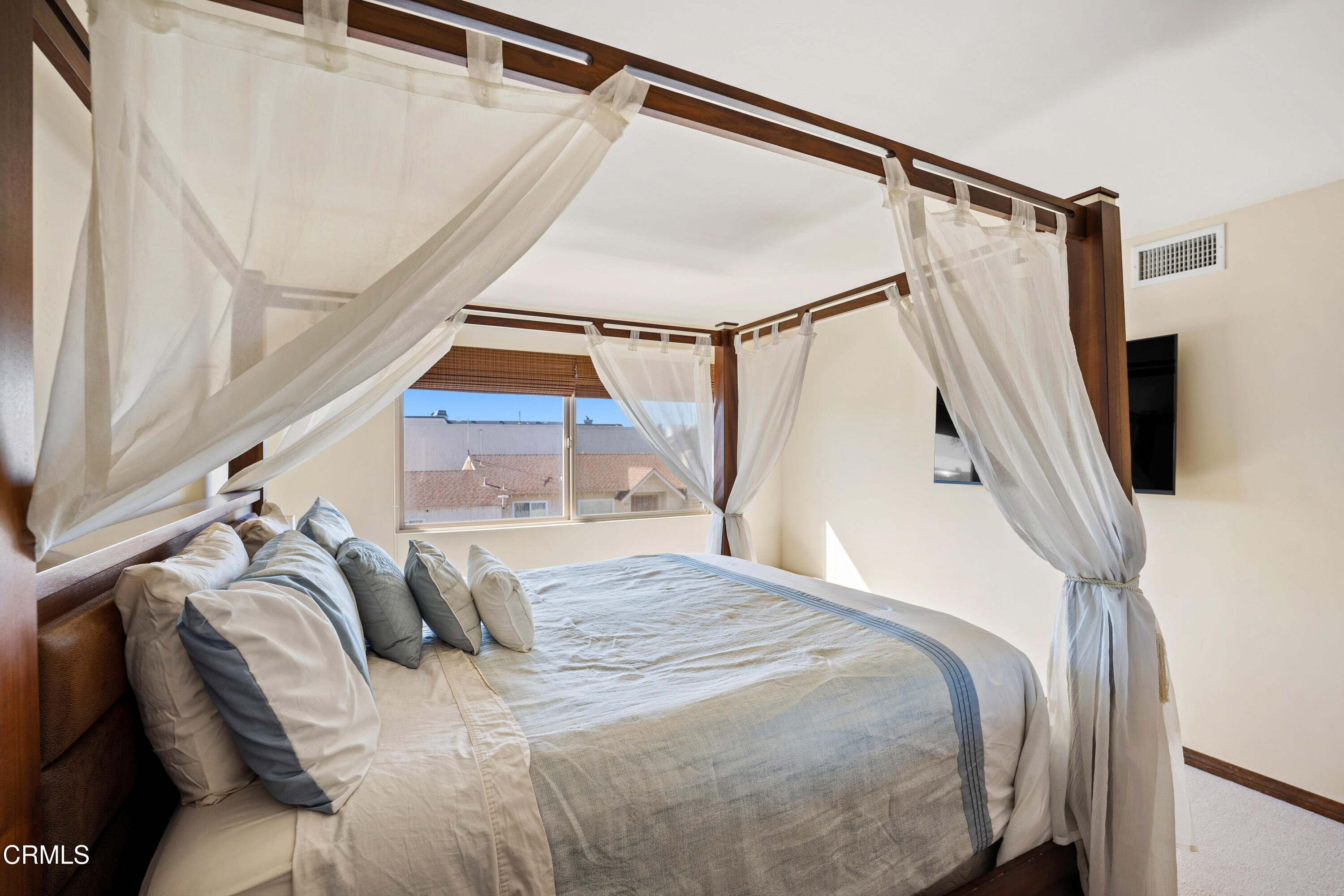 1150 Mandalay Beach Road Oxnard, CA 93035 - Photo 19 of 48 a bed sitting in a bedroom next to a window