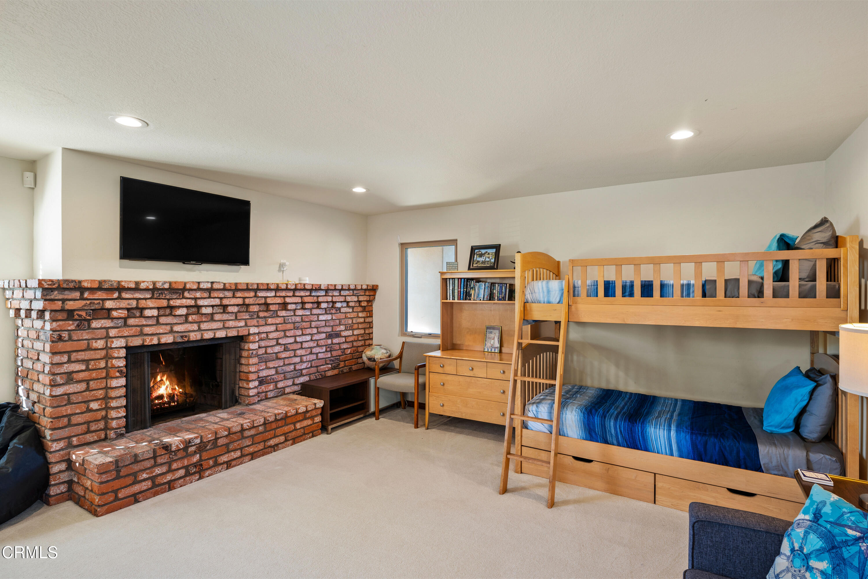 1150 Mandalay Beach Road Oxnard, CA 93035 - Photo 26 of 48 a living room with furniture a flat screen tv and a fireplace