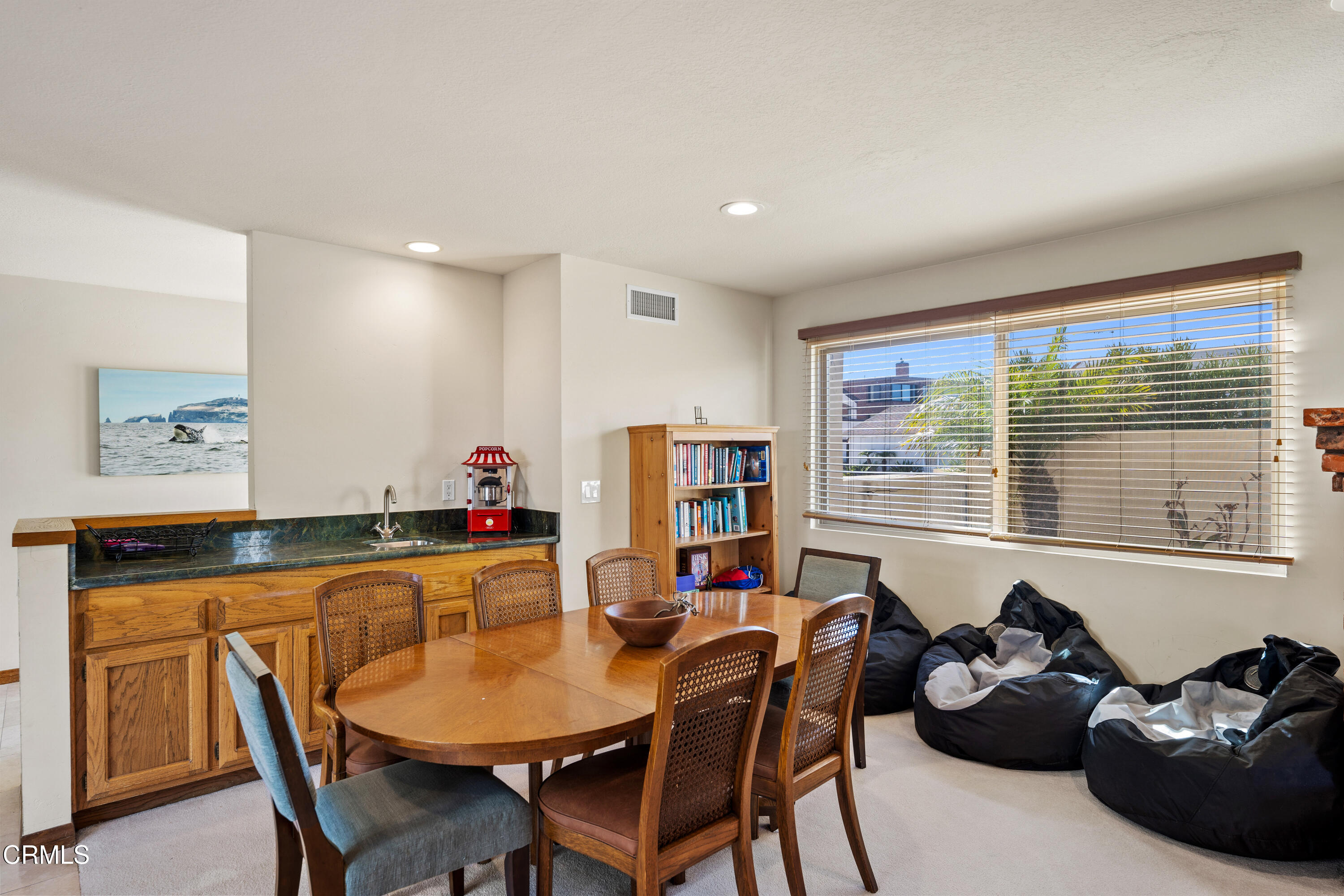 1150 Mandalay Beach Road Oxnard, CA 93035 - Photo 28 of 48 a dining room with furniture and window