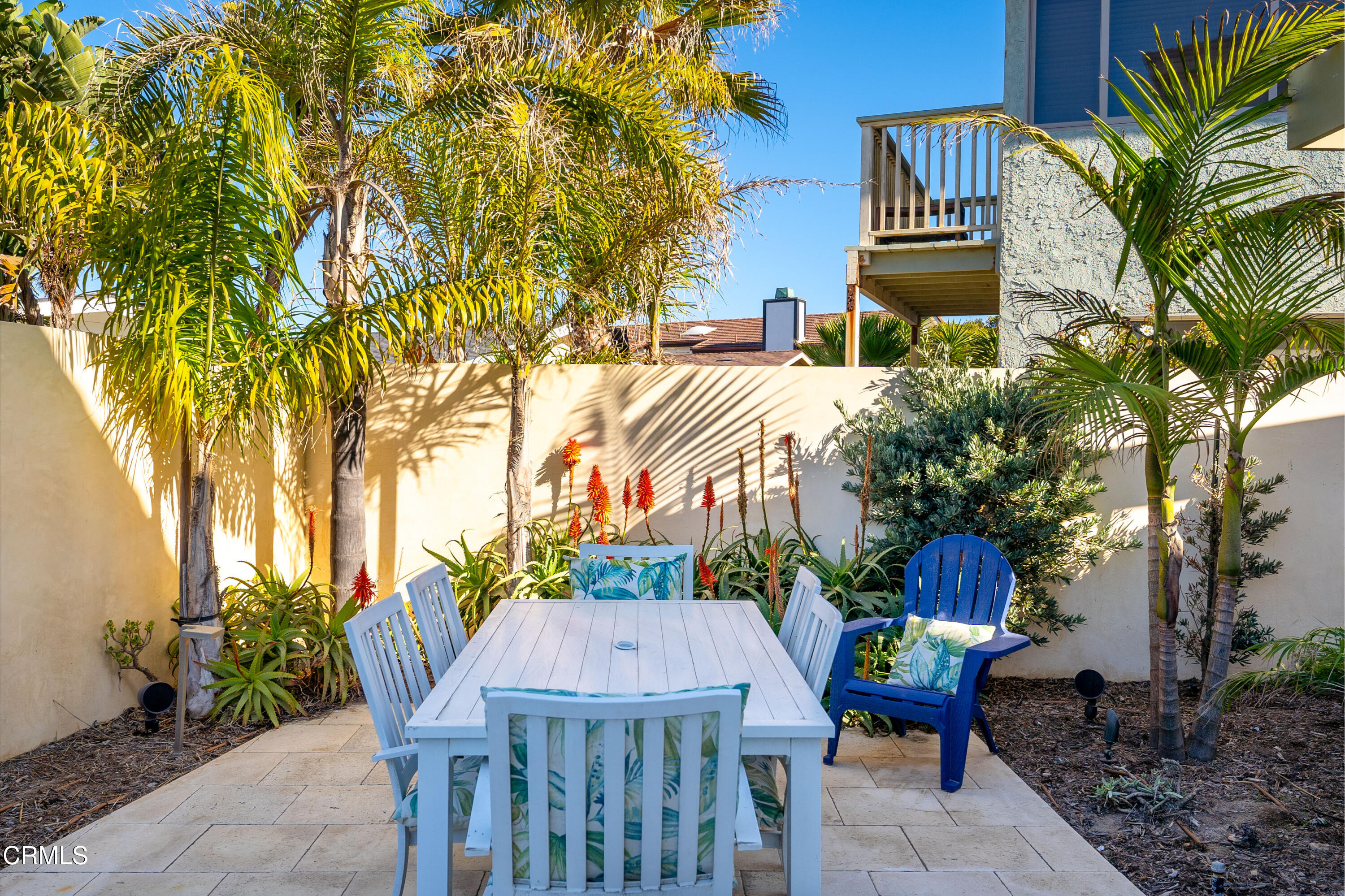 1150 Mandalay Beach Road Oxnard, CA 93035 - Photo 33 of 48 a view of a patio with table and chairs and potted plants