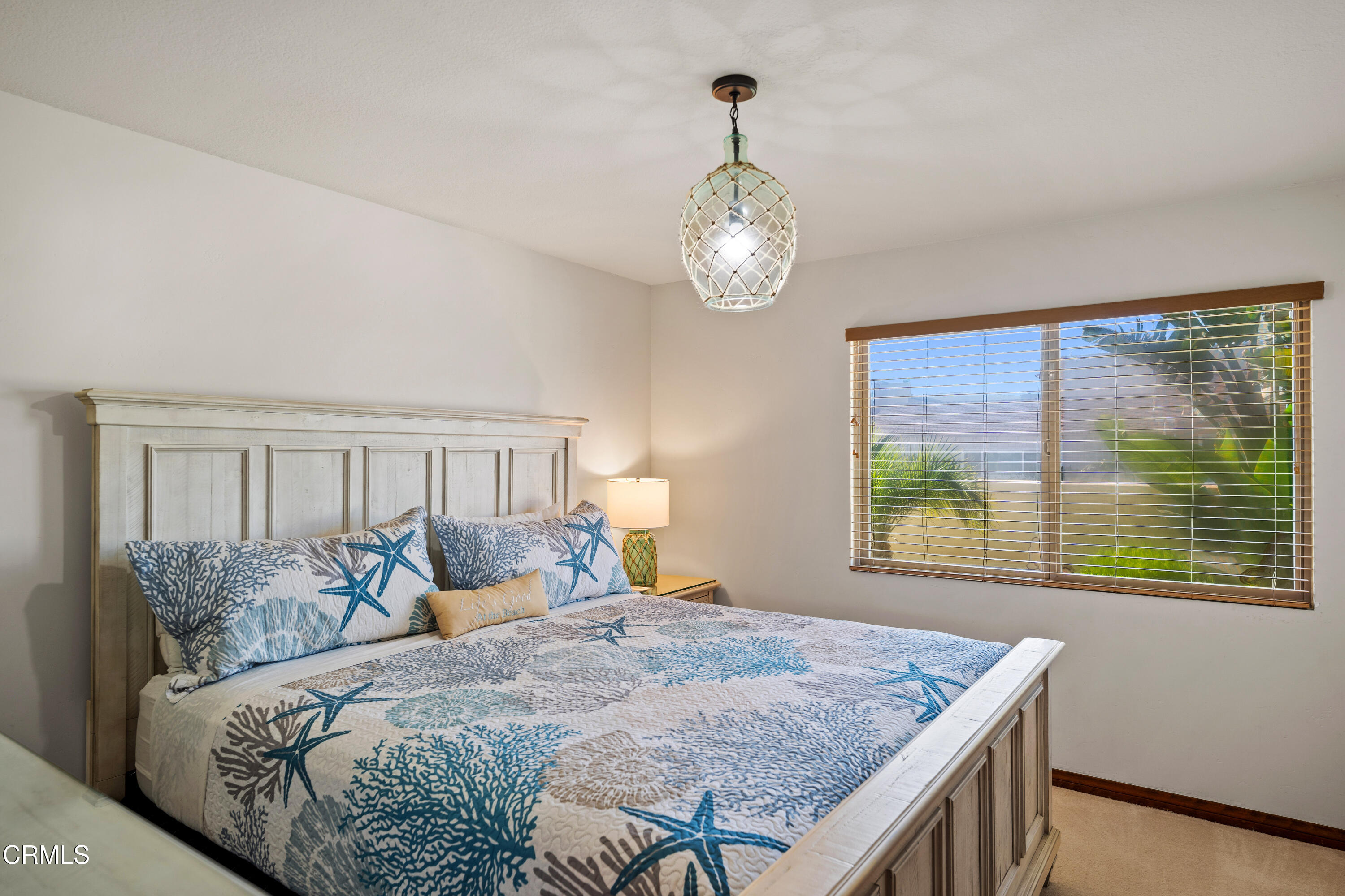 1150 Mandalay Beach Road Oxnard, CA 93035 - Photo 37 of 48 a bed sitting in a bedroom next to a window