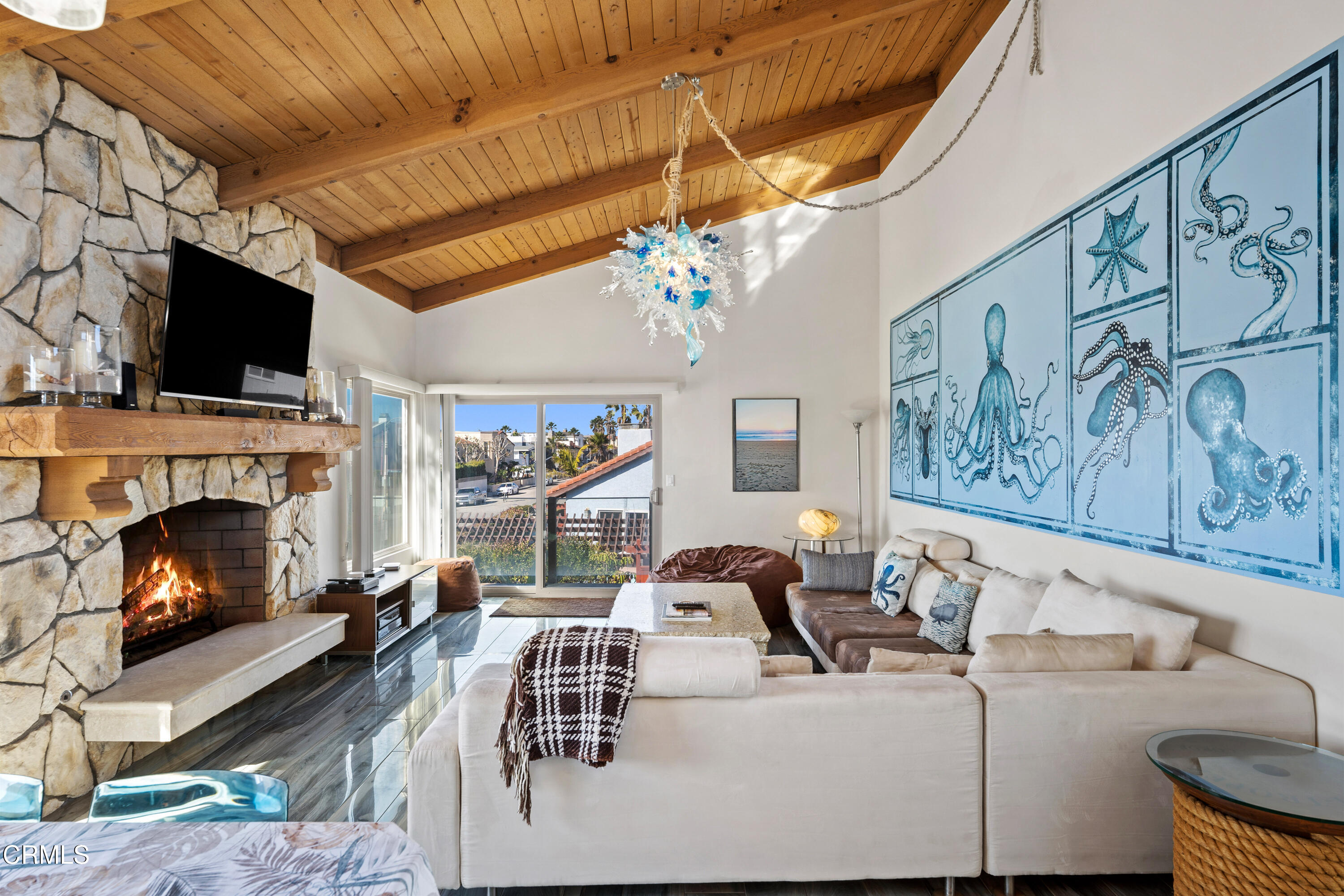 1150 Mandalay Beach Road Oxnard, CA 93035 - Photo 5 of 48 a living room with furniture a fireplace and a flat screen tv
