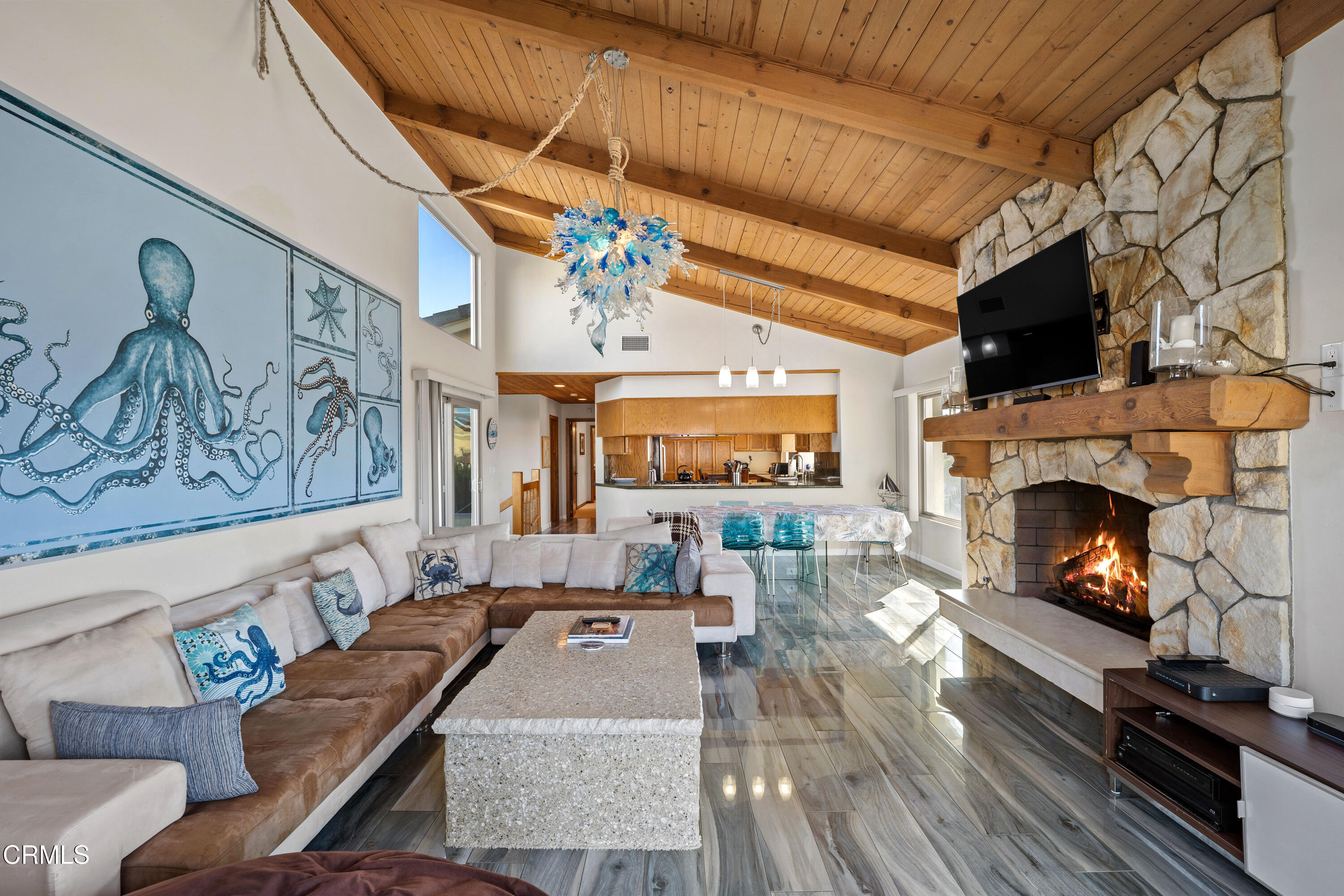 1150 Mandalay Beach Road Oxnard, CA 93035 - Photo 8 of 48 a living room with furniture a flat screen tv and a fireplace