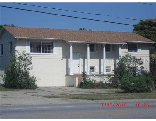 a front view of a house with garage
