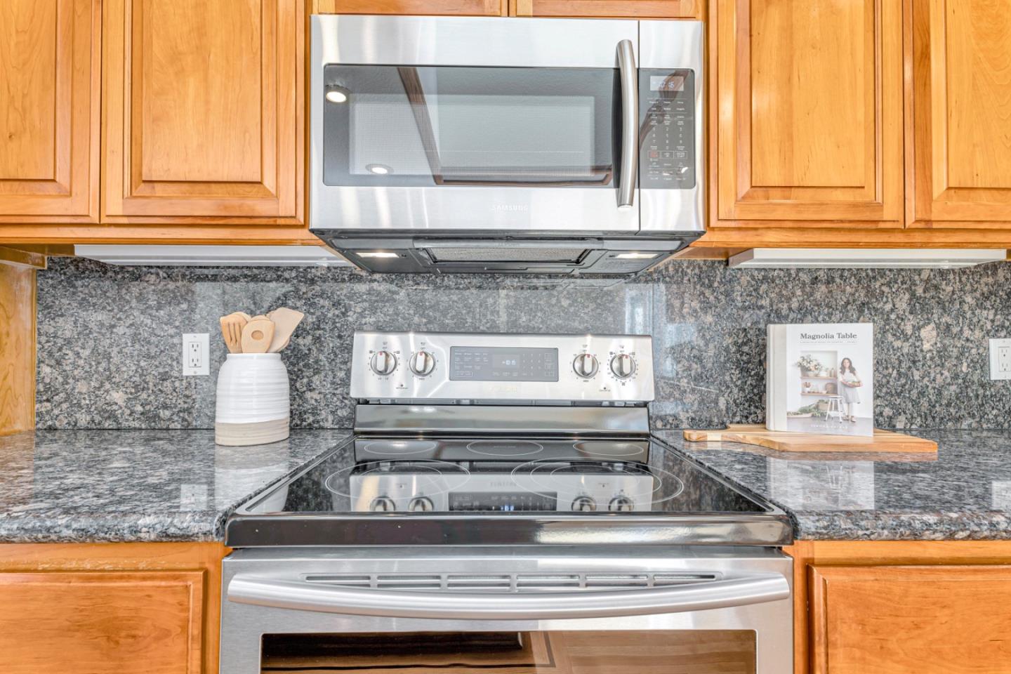 4692 Mia Circle San Jose, CA 95136 - Photo 16 of 42 a stove top oven sitting inside of a kitchen