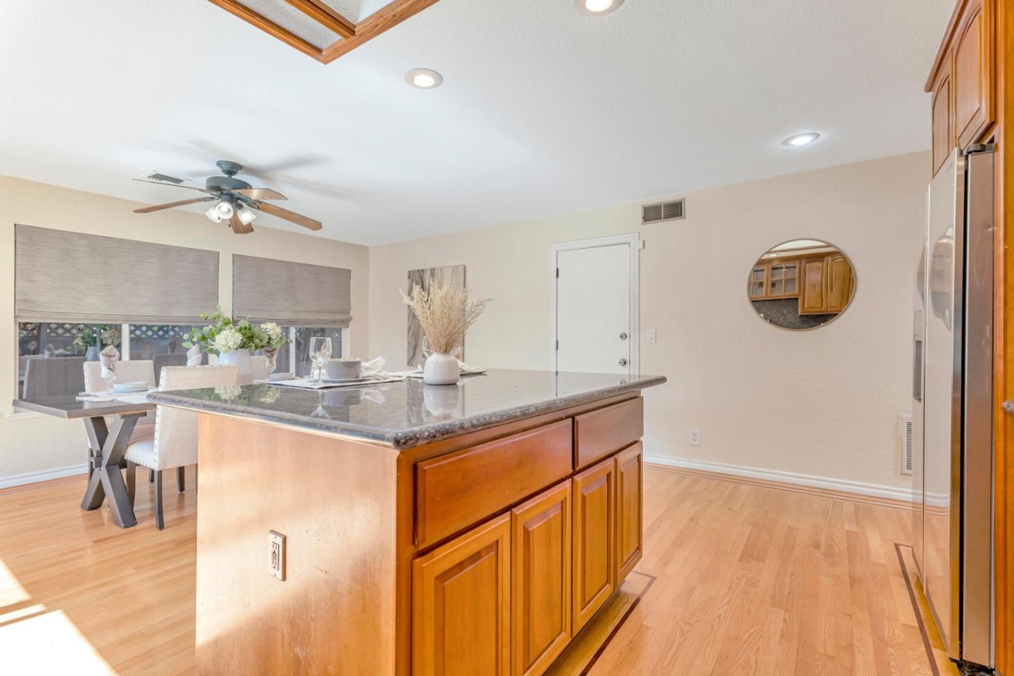 4692 Mia Circle San Jose, CA 95136 - Photo 19 of 42 a kitchen with stainless steel appliances granite countertop a sink and a refrigerator