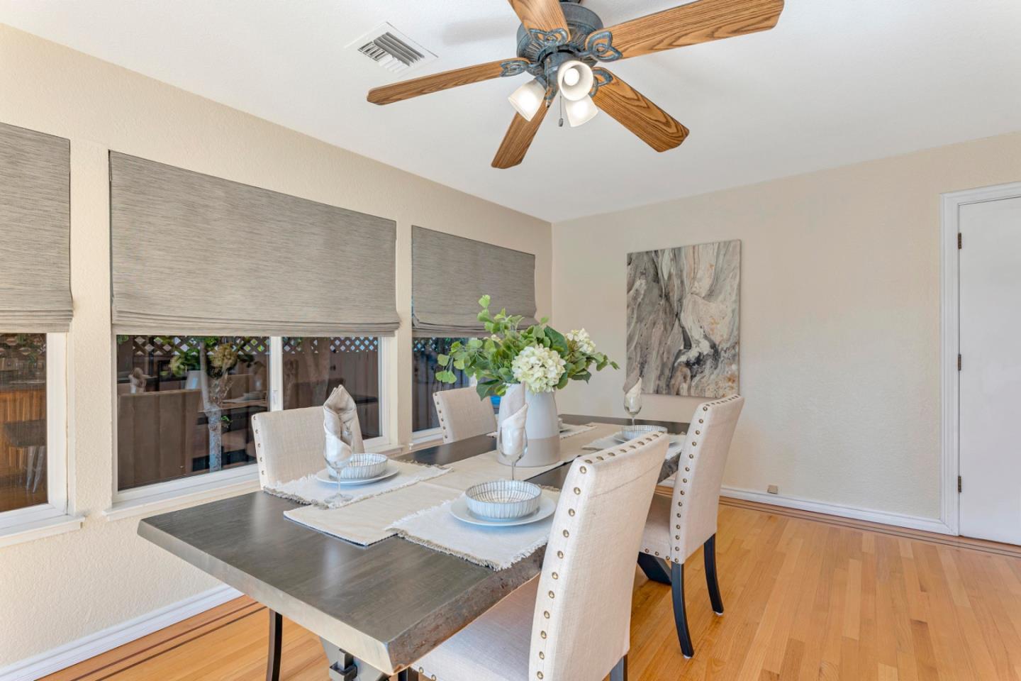 4692 Mia Circle San Jose, CA 95136 - Photo 20 of 42 a view of a dining room with furniture and wooden floor