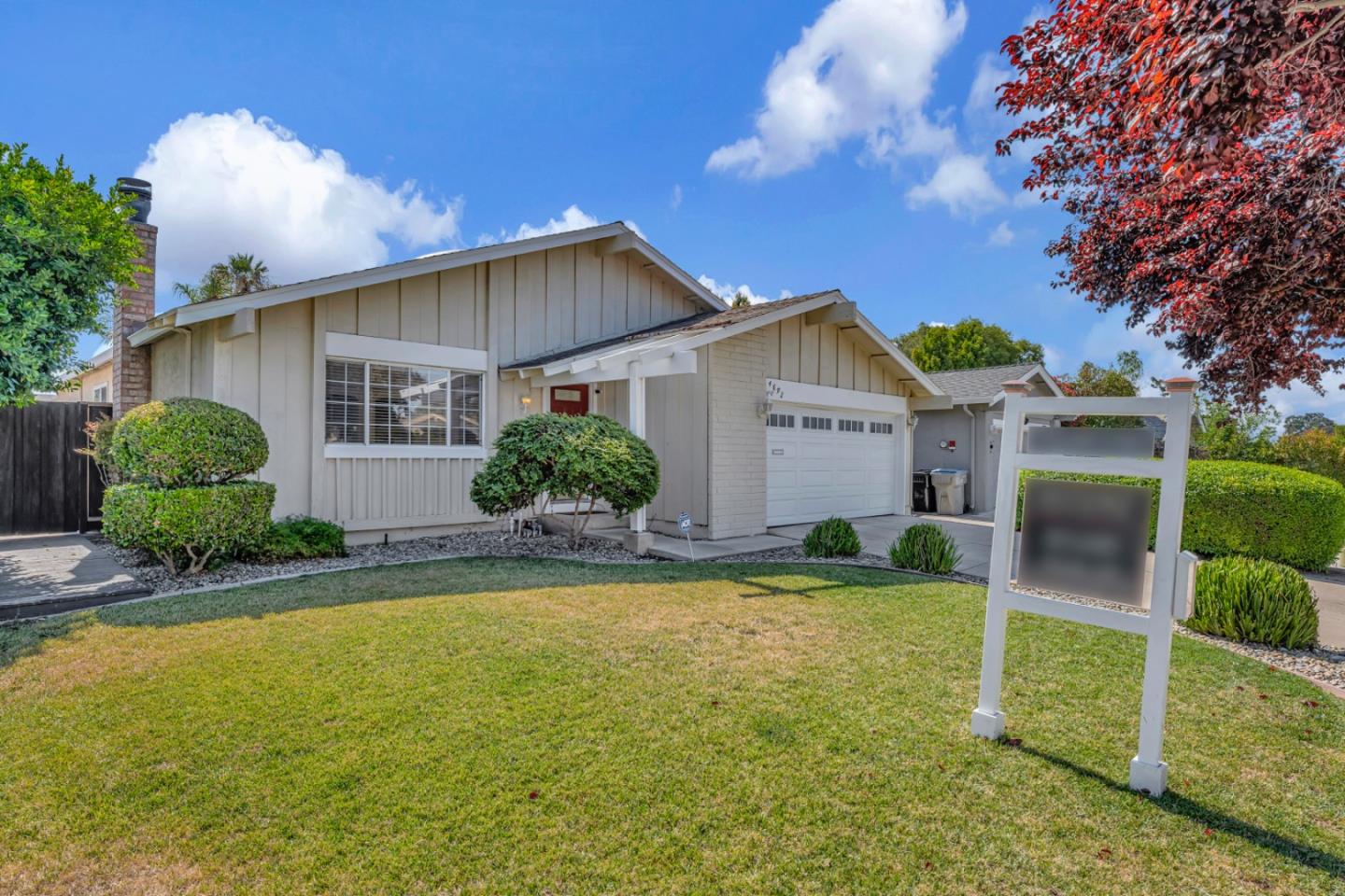 4692 Mia Circle San Jose, CA 95136 - Photo 2 of 42 a front view of a house with a yard