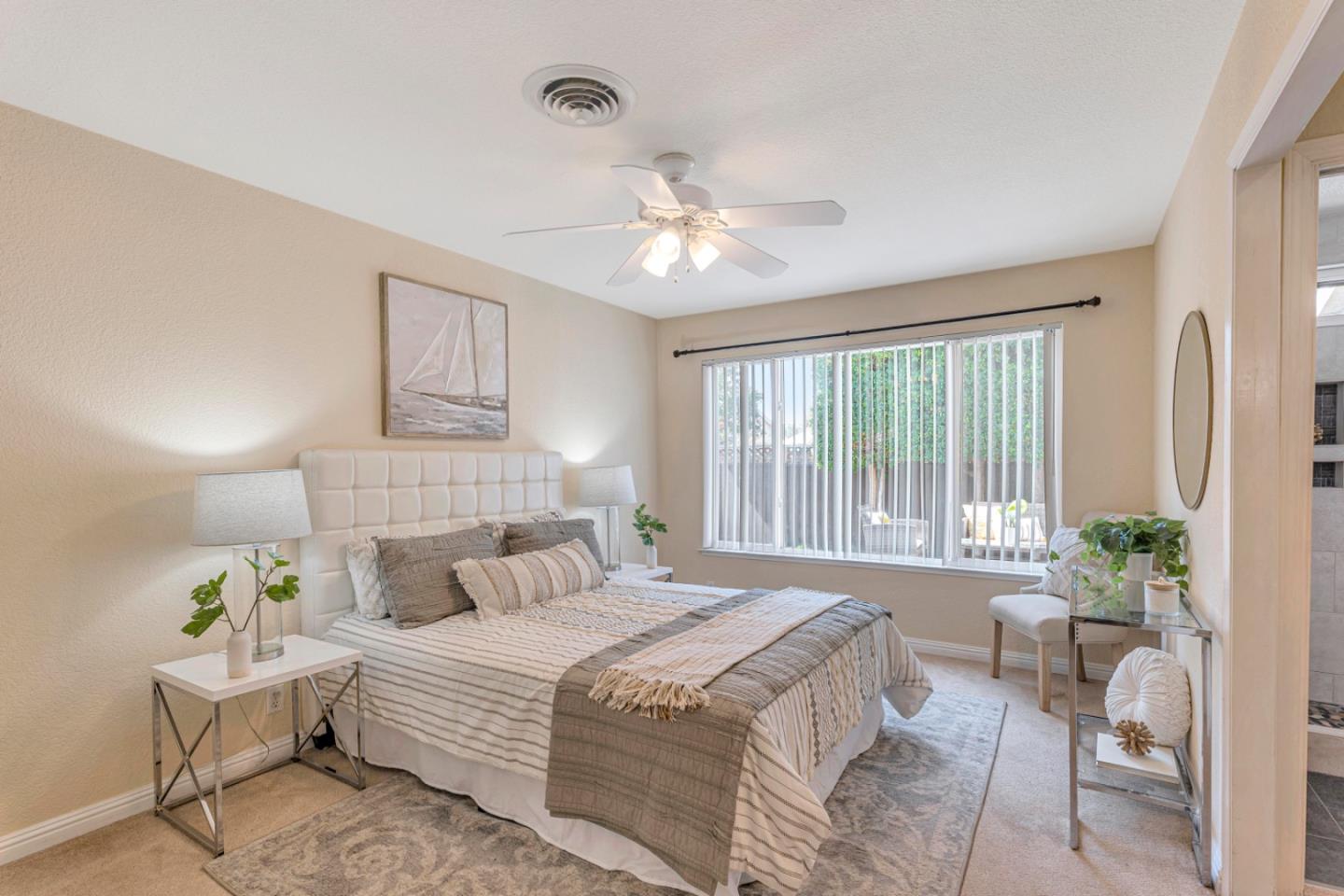 4692 Mia Circle San Jose, CA 95136 - Photo 23 of 42 a bedroom with a bed and a table