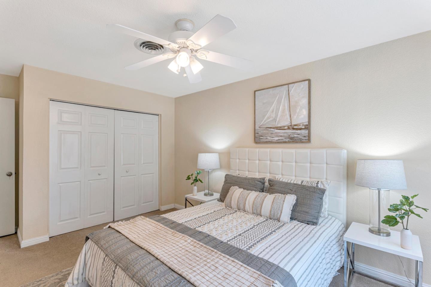 4692 Mia Circle San Jose, CA 95136 - Photo 24 of 42 a bedroom with a bed and a chandelier