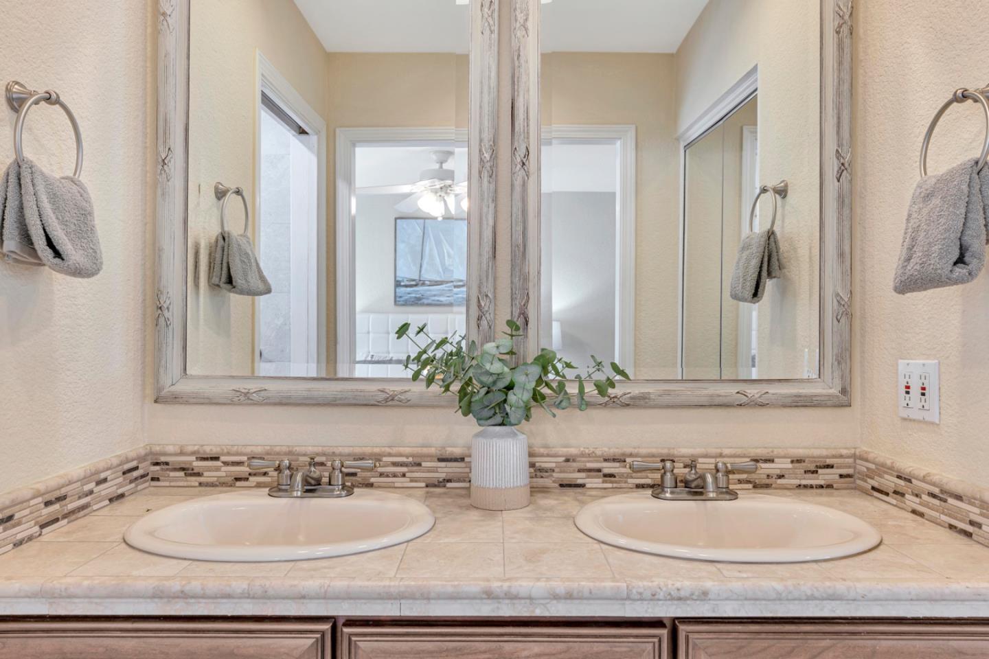 4692 Mia Circle San Jose, CA 95136 - Photo 27 of 42 a bathroom with a sink and a mirror