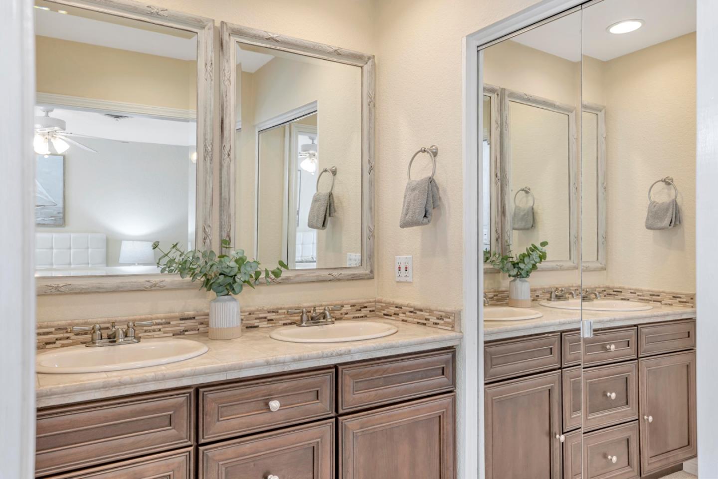4692 Mia Circle San Jose, CA 95136 - Photo 28 of 42 a bathroom with a sink and a mirror