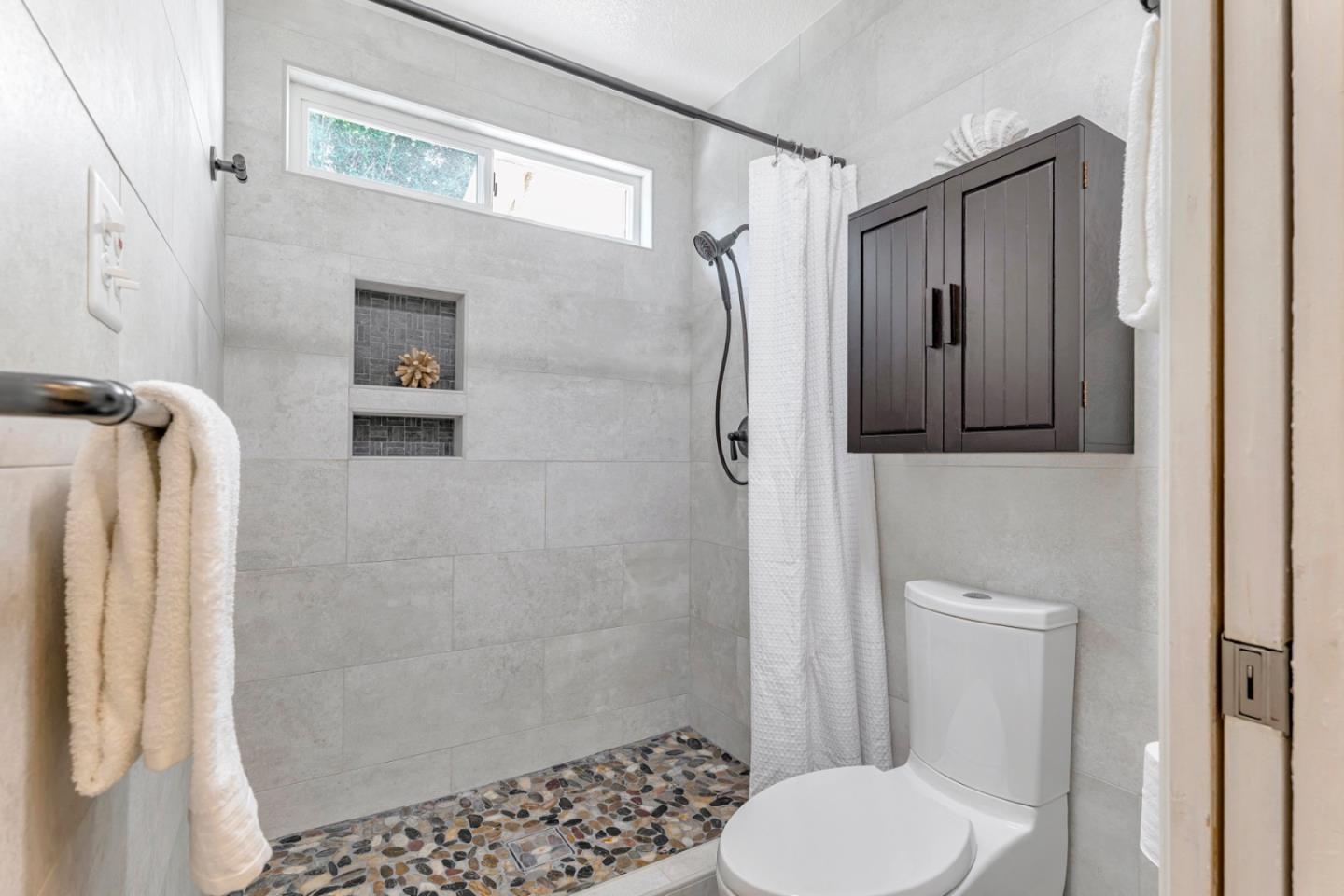 4692 Mia Circle San Jose, CA 95136 - Photo 29 of 42 a bathroom with a shower and a toilet