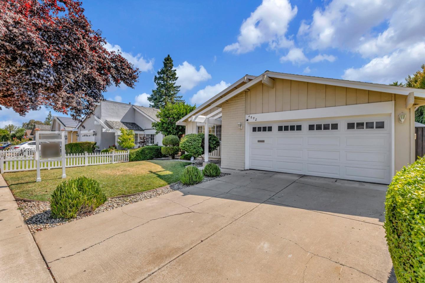 4692 Mia Circle San Jose, CA 95136 - Photo 3 of 42 a view of a house with a yard and potted plants