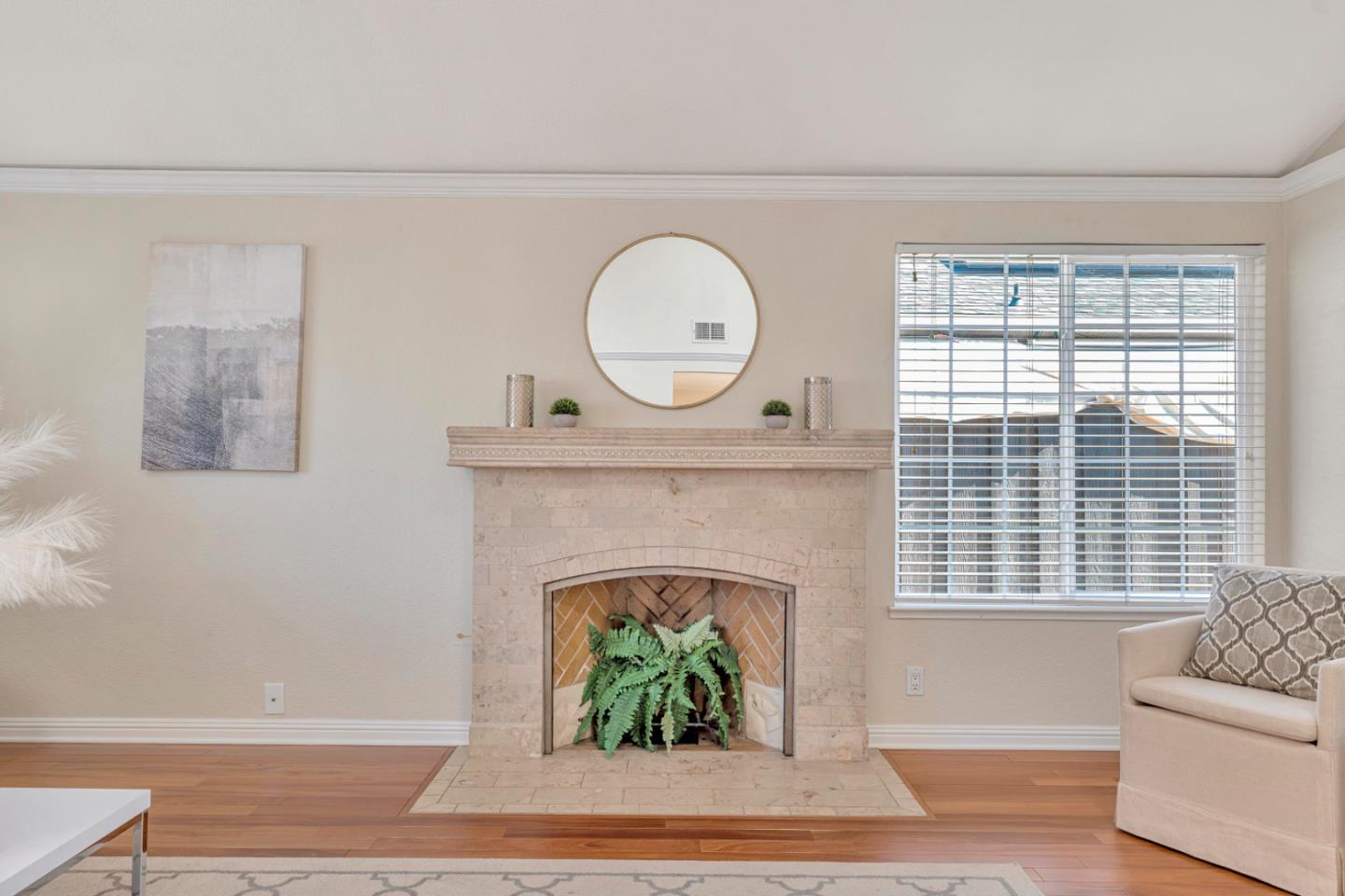 4692 Mia Circle San Jose, CA 95136 - Photo 8 of 42 a living room with a fireplace and a floor