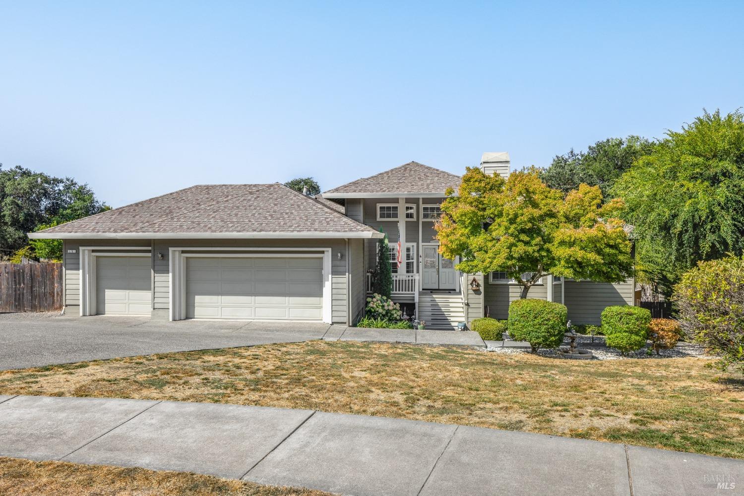 front view of a house with a yard