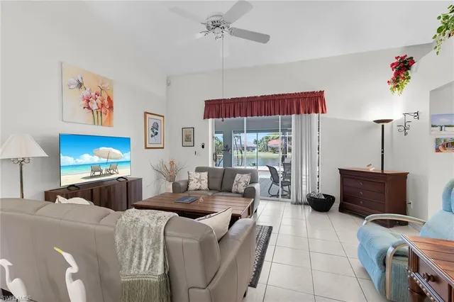 a living room with furniture a desk and chair