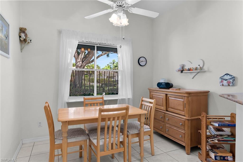 443 Dundee Court Naples, FL 34104 - Photo 21 of 39 a dining room with furniture and window