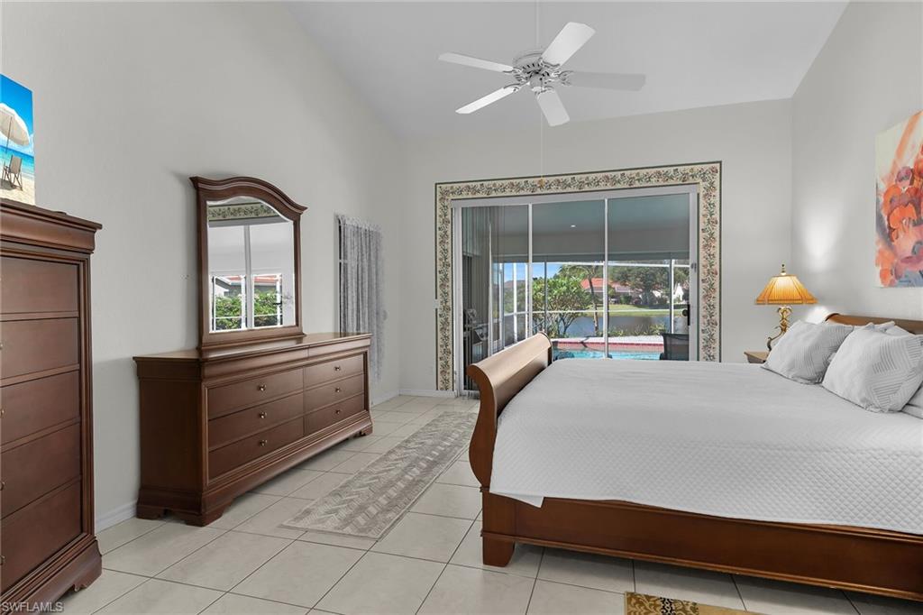 443 Dundee Court Naples, FL 34104 - Photo 26 of 39 a bedroom with a large bed and a window