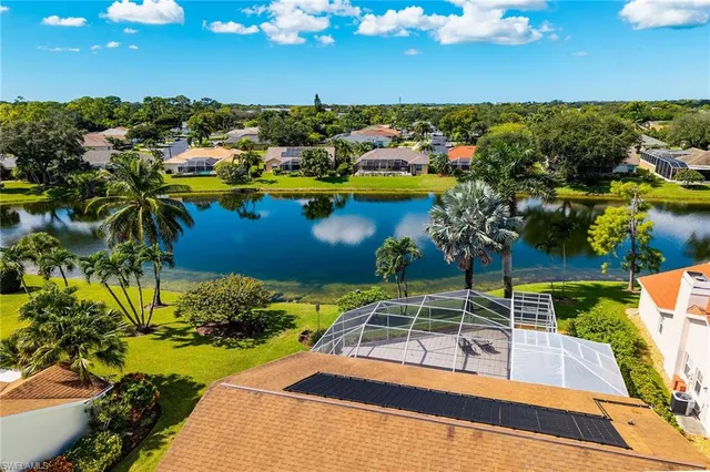 a view of a swimming pool with a table and chairs