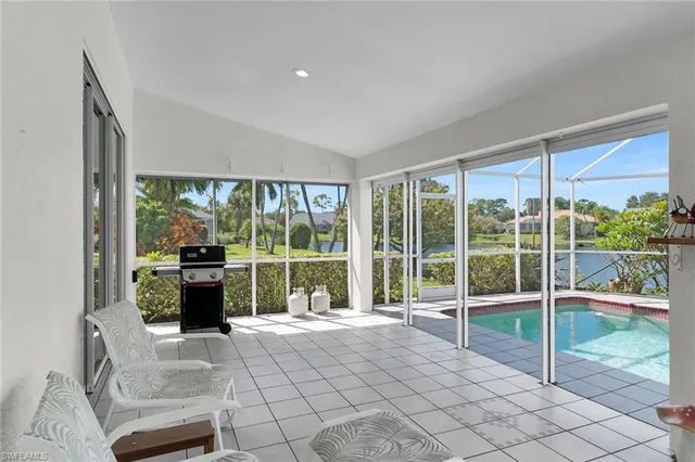 a view of a living room and floor to ceiling window