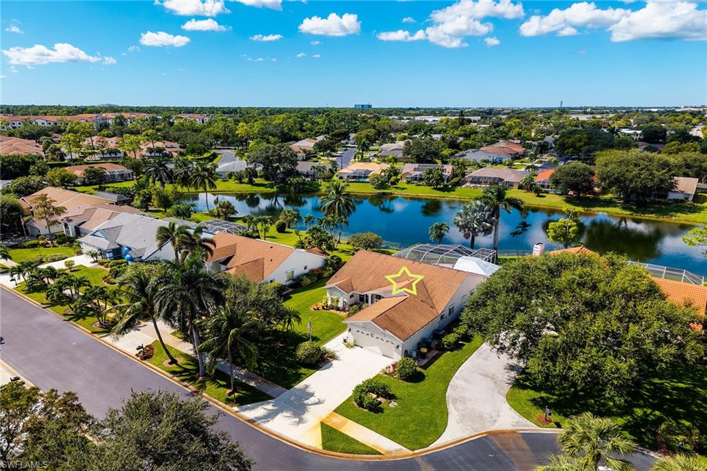 443 Dundee Court Naples, FL 34104 - Photo 37 of 39 an aerial view of a house