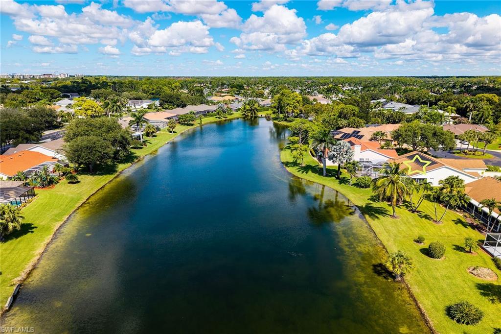 443 Dundee Court Naples, FL 34104 - Photo 39 of 39 a view of a lake with a city