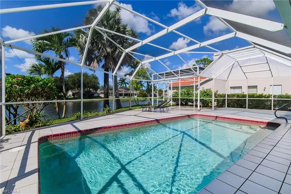 a view of a backyard with swimming pool