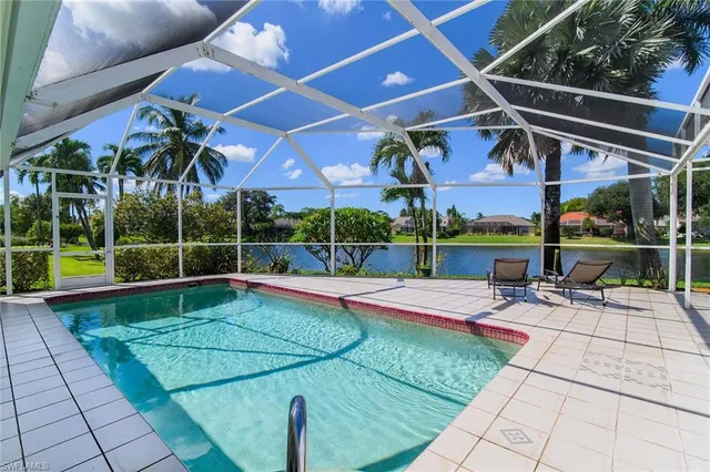 a view of a backyard with sitting area and tub