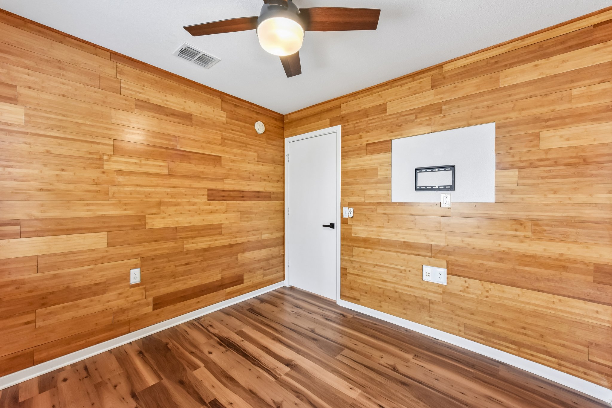 5405 Rusk Court Austin, TX 78723 - Photo 28 of 40 Secondary Bedroom #1: complete with a modern ceiling fan.