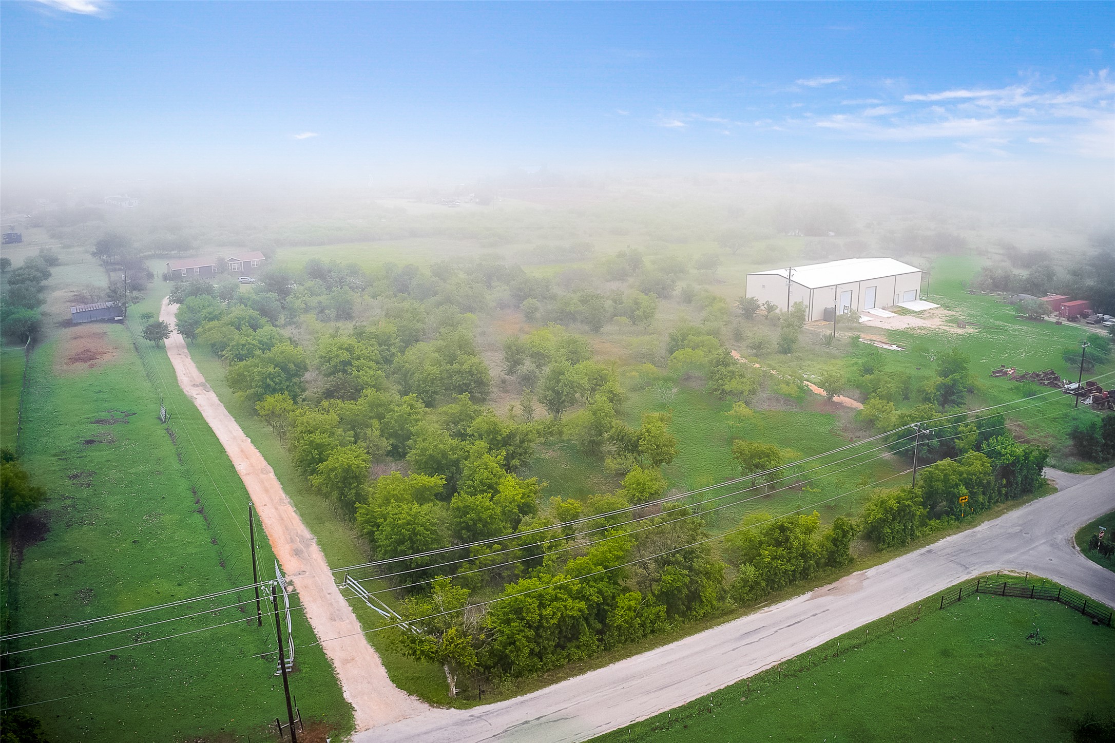 754 Williamson Road, Unit B Niederwald, TX 78640 - Photo 3 of 16 a view of a green yard with an outdoor seating