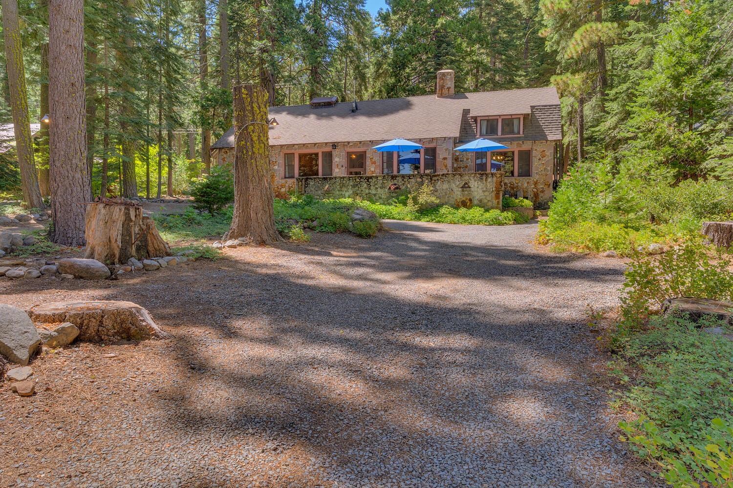 4715 Cedar Homewood, CA 96141 - Photo 1 of 25 a front view of a house with yard and trees