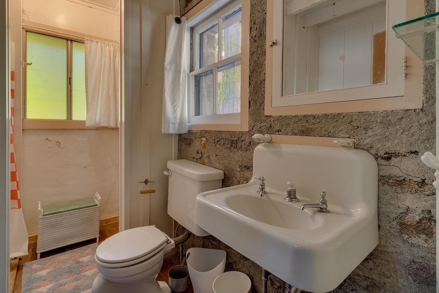 4715 Cedar Homewood, CA 96141 - Photo 19 of 25 a bathroom with a sink a toilet and a mirror