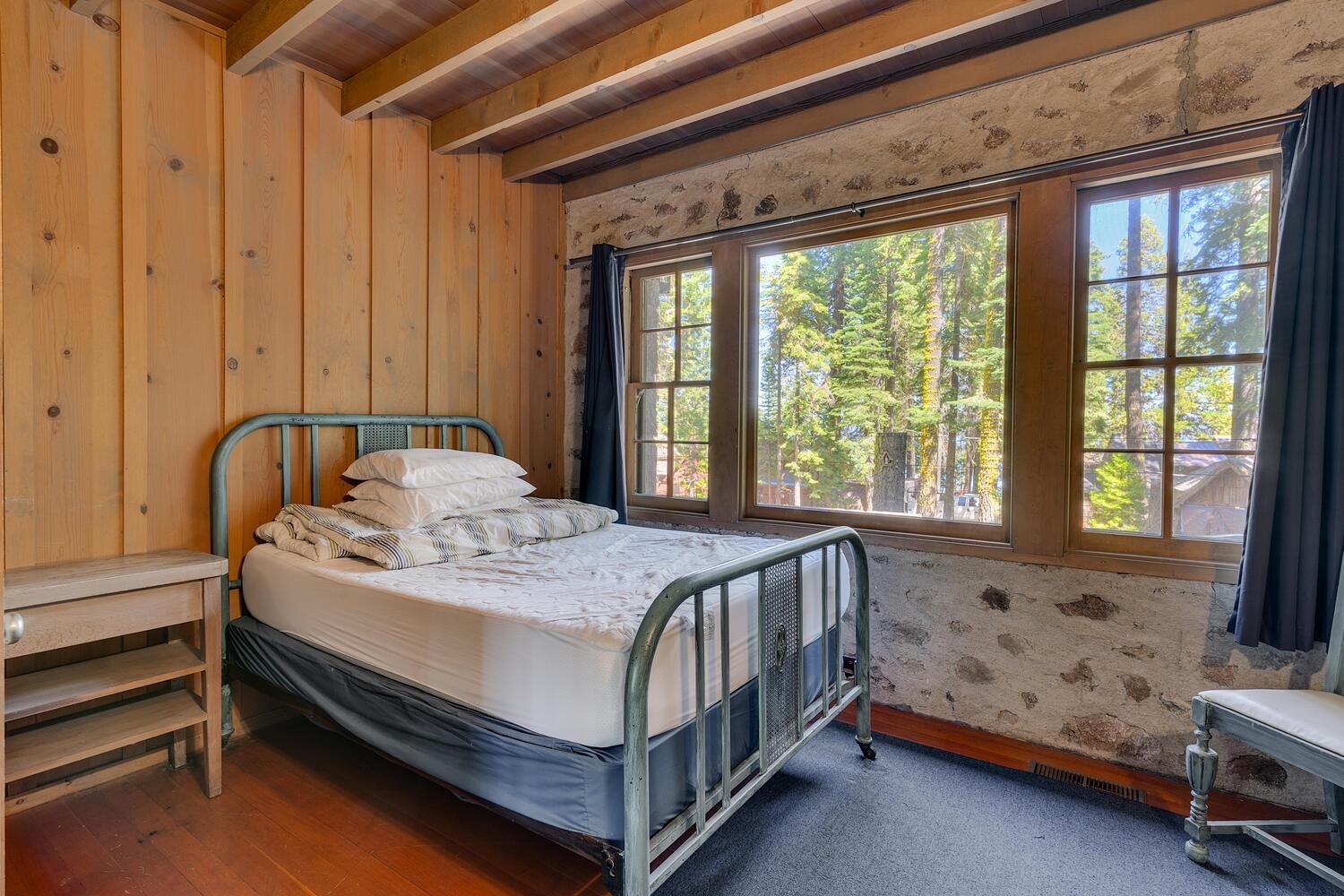 4715 Cedar Homewood, CA 96141 - Photo 20 of 25 a bed sitting in a bedroom next to a window