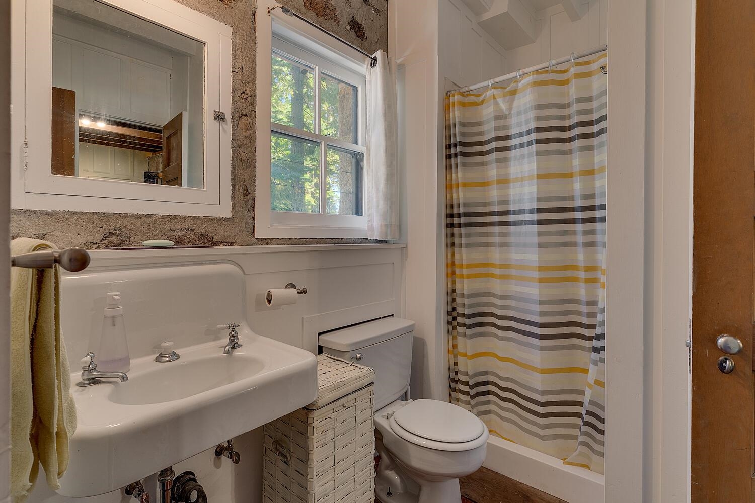 4715 Cedar Homewood, CA 96141 - Photo 21 of 25 a bathroom with a sink toilet and mirror