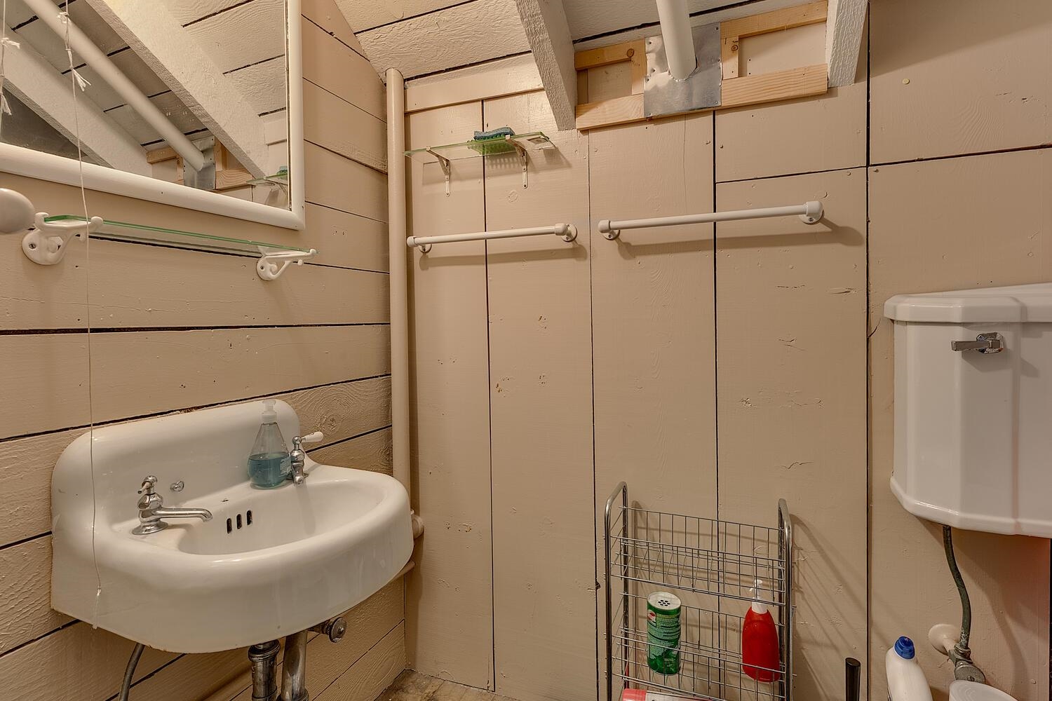 4715 Cedar Homewood, CA 96141 - Photo 25 of 25 a bathroom with a sink a mirror and shower