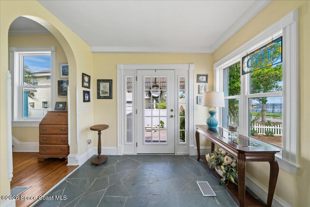 1110 Riverside Drive Titusville, FL 32780 - Photo 5 of 50 a view of an entryway with furniture and windows