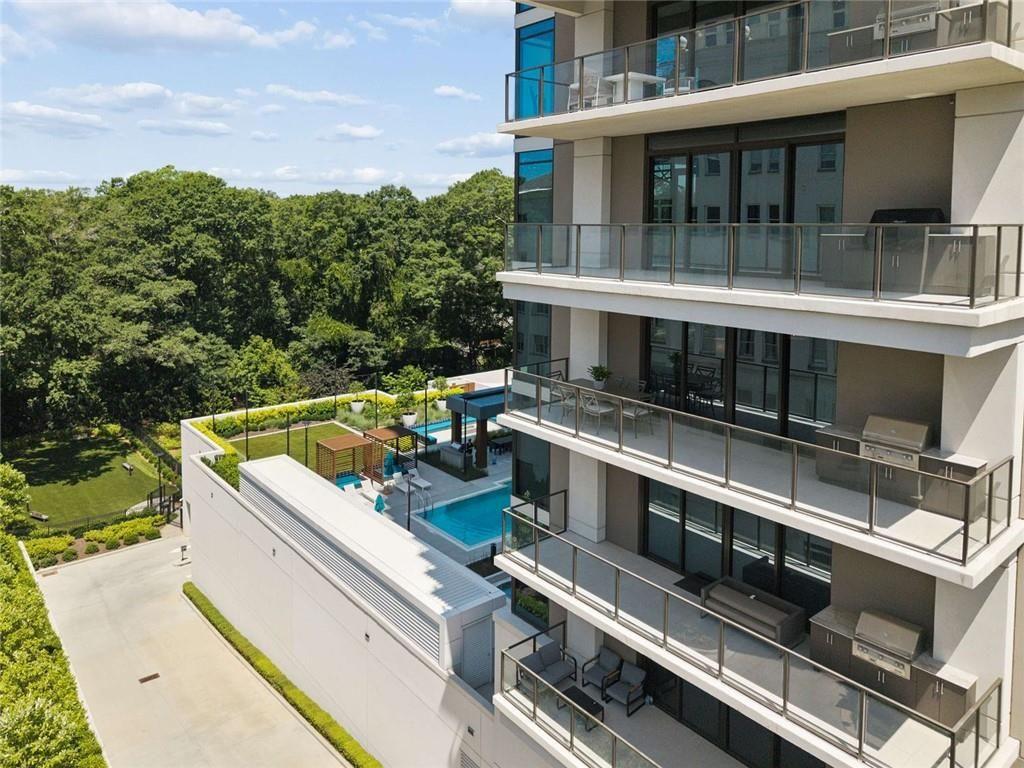 2520 Peachtree Road, Unit 603 Atlanta, GA 30305 - Photo 55 of 91 a view of a balcony with stainless steel appliances wooden floor and city view
