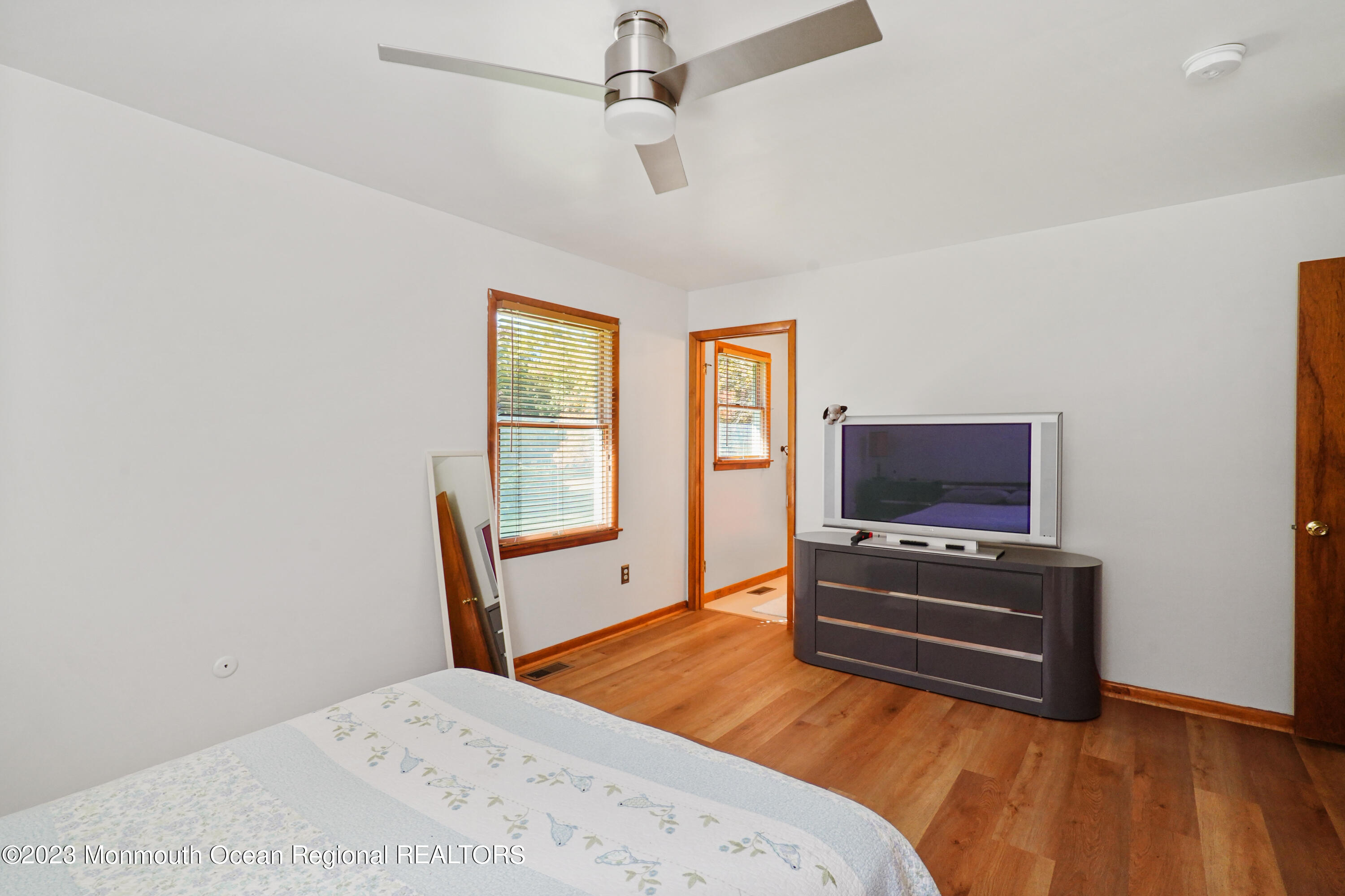 222 Leesville Road Jackson, NJ 08527 - Photo 23 of 61 a bedroom with furniture and a flat screen tv